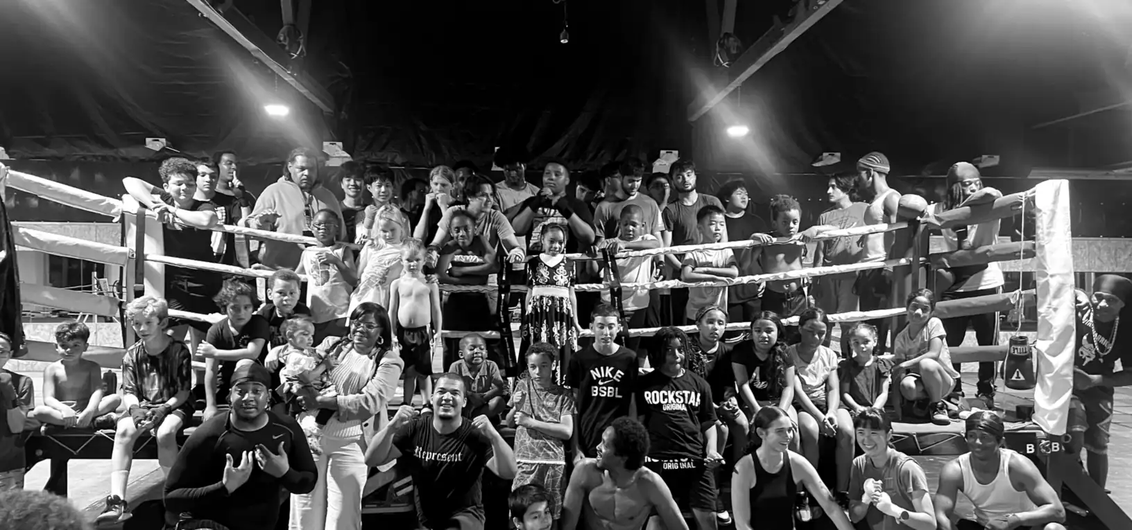 K.O. Fitness members and youth boxers gathered around the ring in Seattle